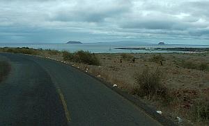 Daphne Major and Daphne Minor, with the island of Santiago in the far distance.